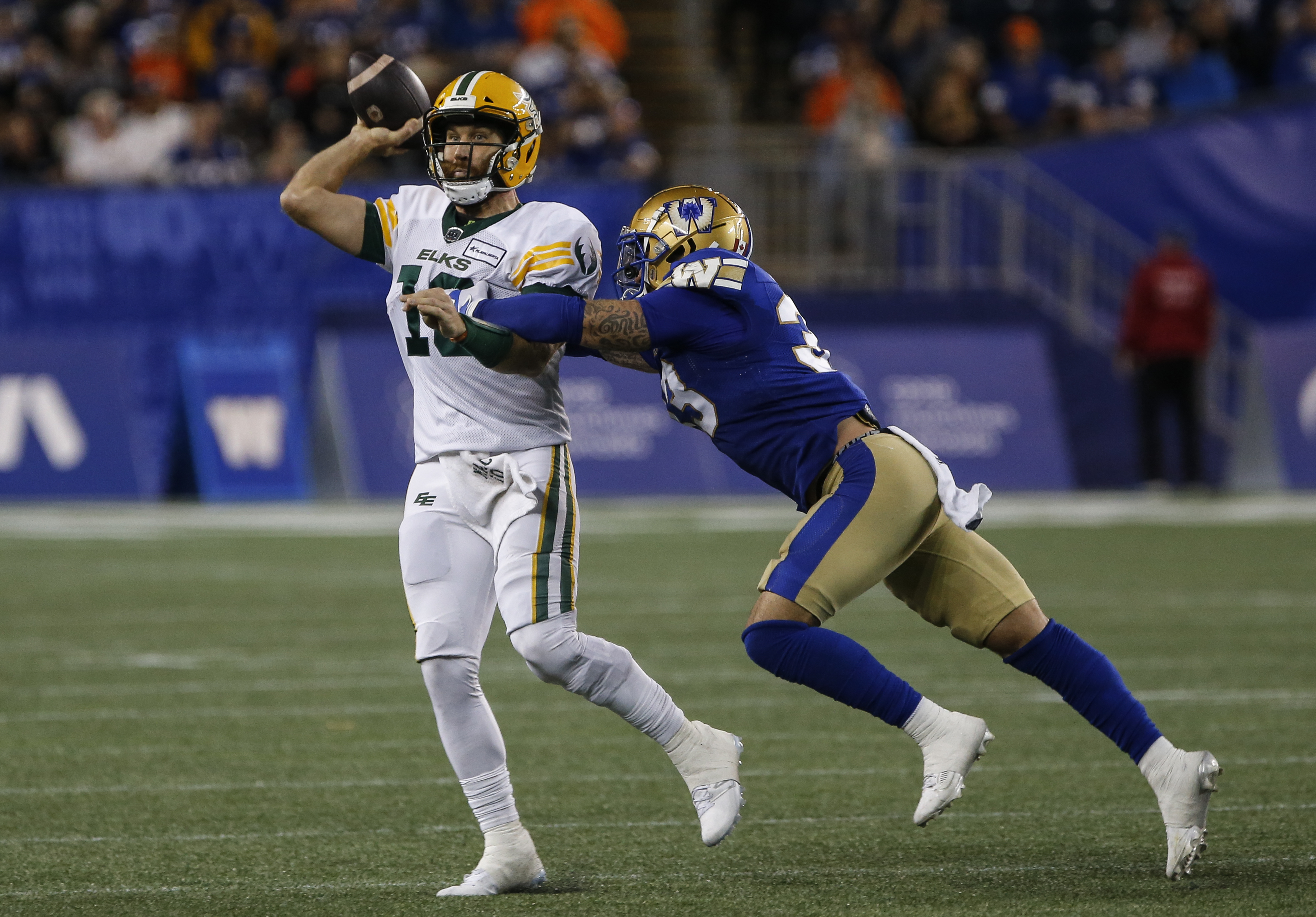 Surging Blue Bombers blitz Elks 55-27, clinch playoff spot