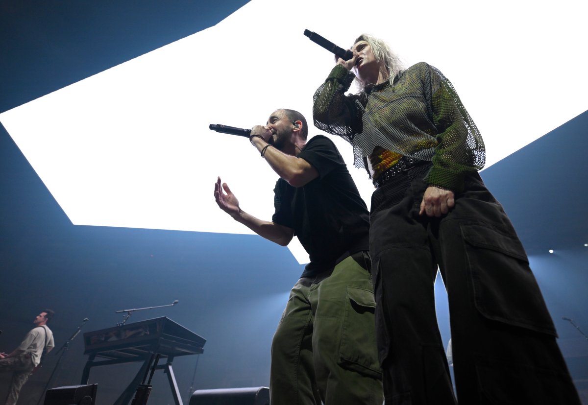 Mike Shinoda (L) and Emily Armstrong (R) perform alongside the rest of Linkin Park during a global livestream at Warner Bros. Studios on September 05, 2024 in Burbank, California.