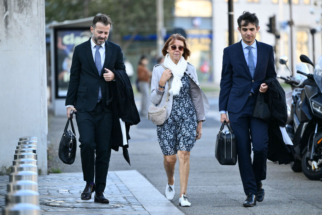 Gisèle Pélicot arrives with her lawyers Stephane Babonneau (R) and Antoine Camus at the Avignon courthouse during the trial of her former partner Dominique Pélicot accused of drugging her for nearly ten years and inviting strangers to rape her at their home in Mazan, a small town in the south of France, in Avignon, on September 17, 2024.