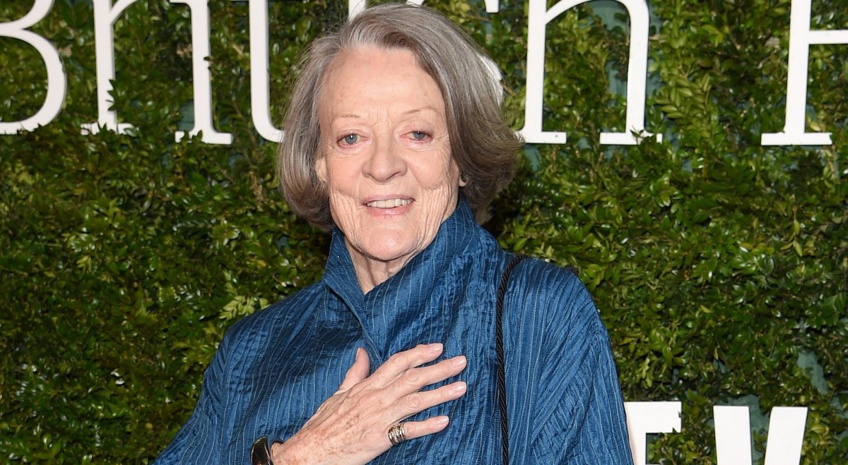 Dame Maggie Smith in a blue coat.