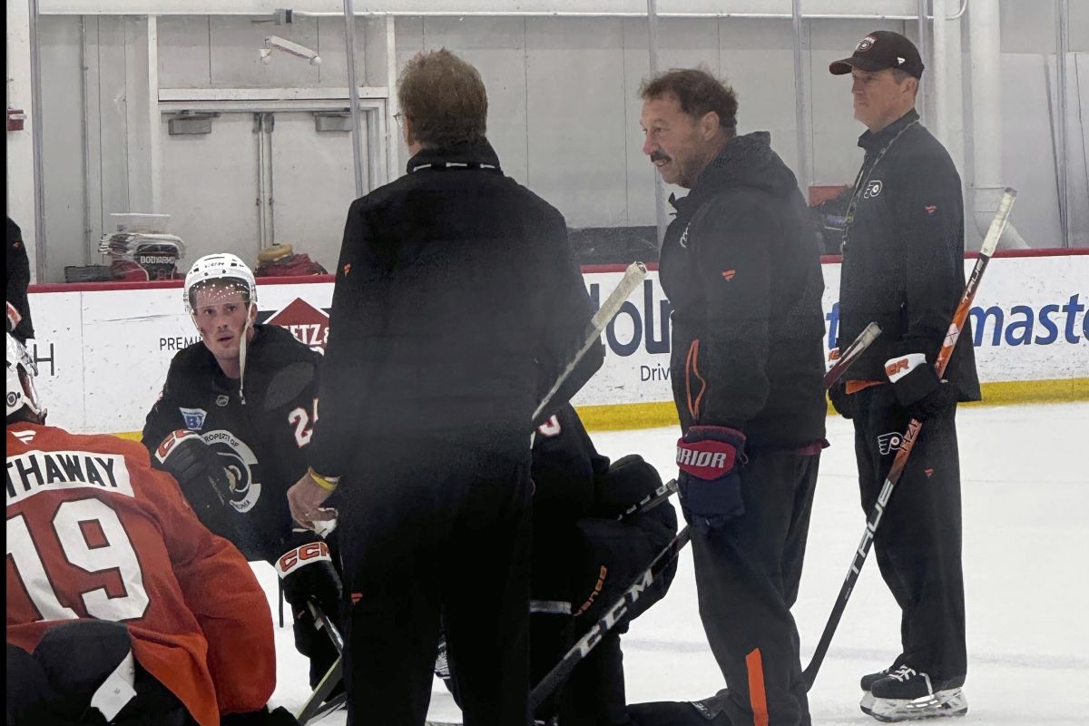 The Philadelphia Flyers host Guy Gaudreau, second from right, the father of Johnny and Matthew Gaudreau, at the team's morning skate, Monday, Sept. 23, 2024, in Voorhees, N.J.