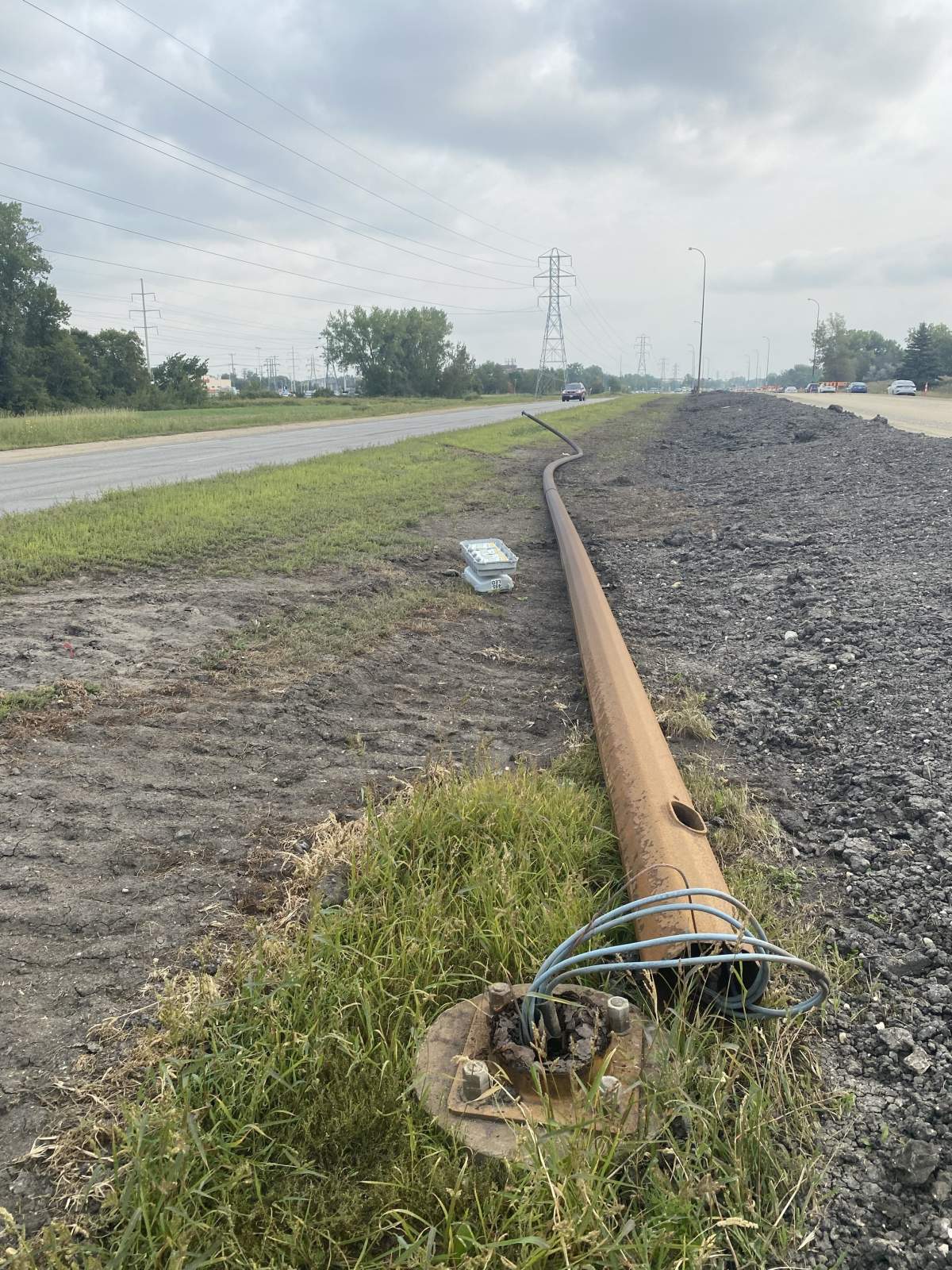 A picture of the streetlamp that fell over on Abinojii Mikanah in Winnipeg Sept. 2, 2024, still at the scene on Sept. 4.