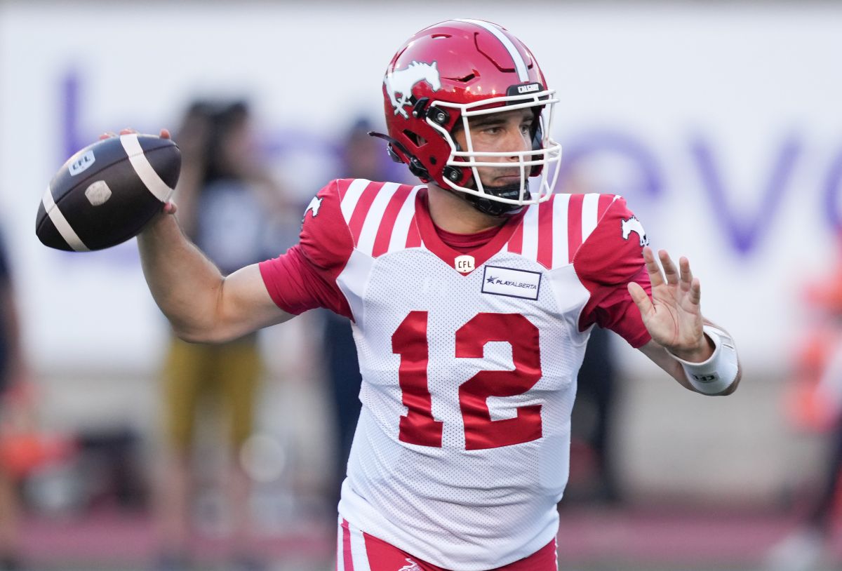 Calgary Stampeders quarterback Jake Maier (12) throws against the Montreal Alouettes during first half CFL football action in Montreal, Saturday, July 6, 2024.