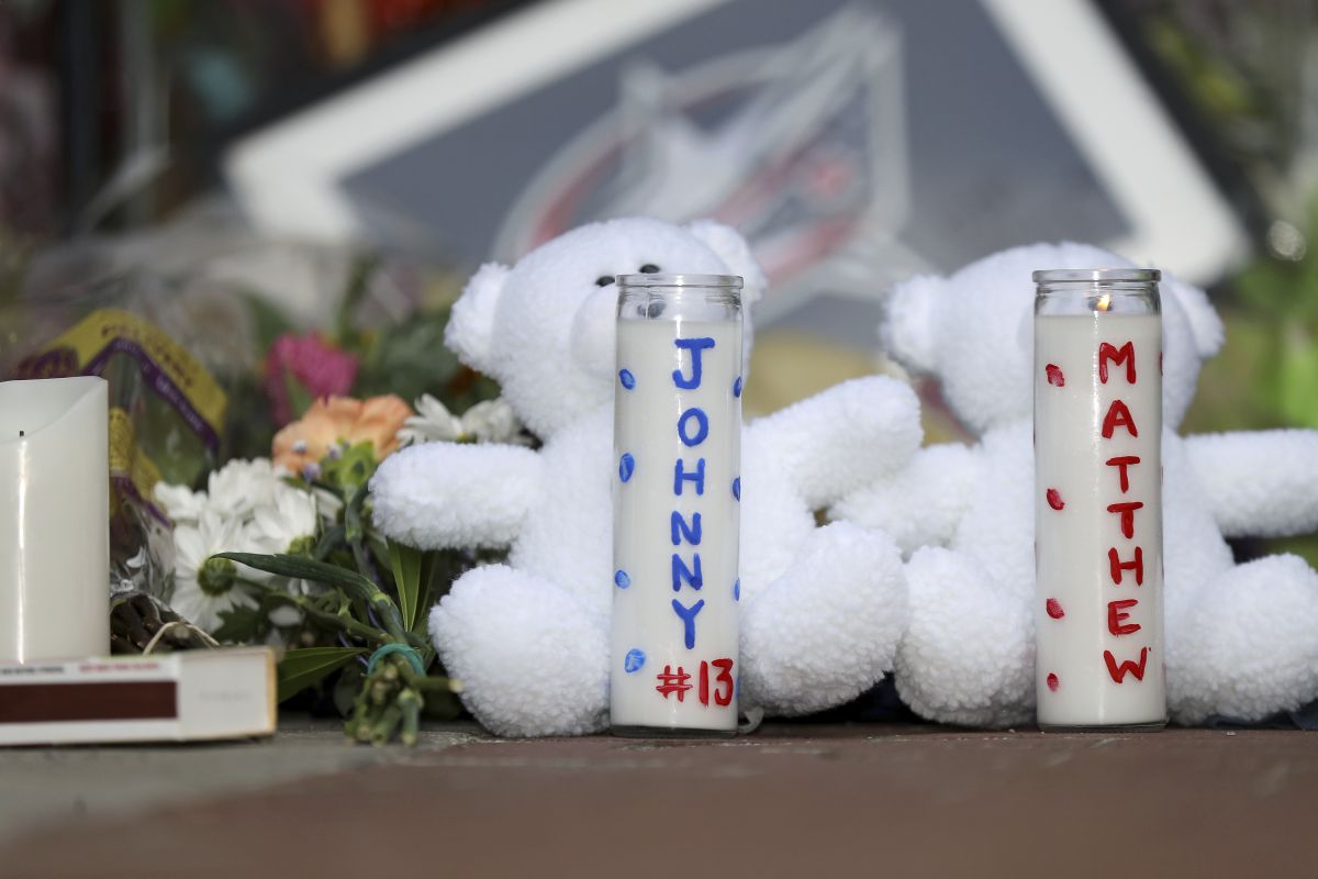 Keepsakes line a memorial set up by fans for Blue Jackets hockey player Johnny Gaudreau in Columbus, Ohio, Aug. 30, 2024. Gaudreau, along with his brother Matthew, was fatally struck by a motorist while riding his bicycle on Thursday.