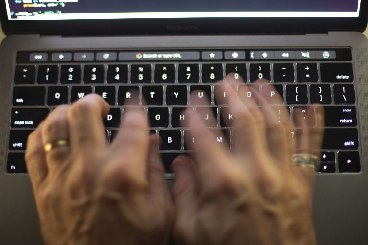 File photo. A man uses a computer keyboard in Toronto in this Sunday, Oct. 9, 2023 photo.