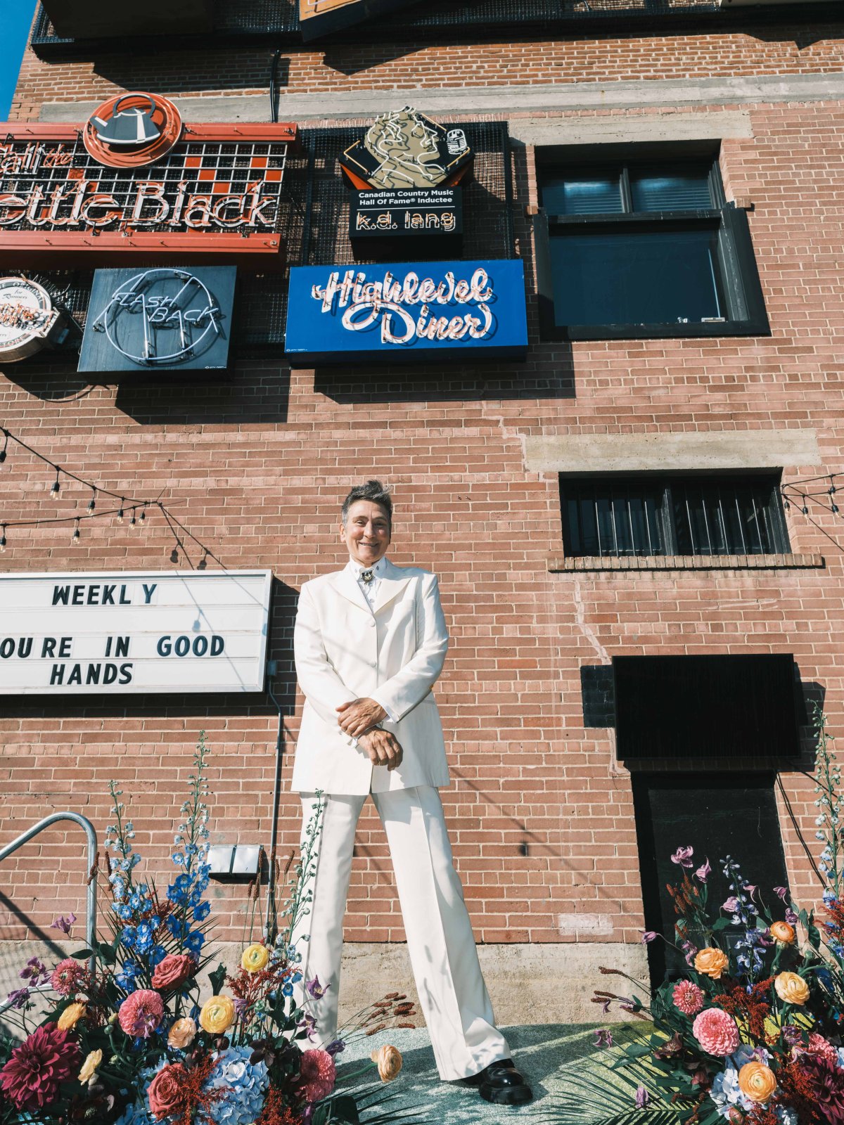 k.d. lang poses in front of a sign put up in her honour at Edmonton's Neon Sign Museum in this undated photo.