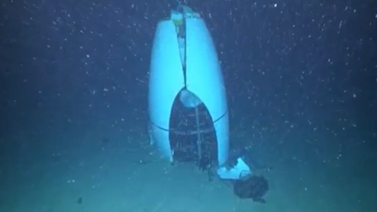 Image of the wreck of the Titan sub, sticking upright in the sand on the floor of the Atlantic Ocean.