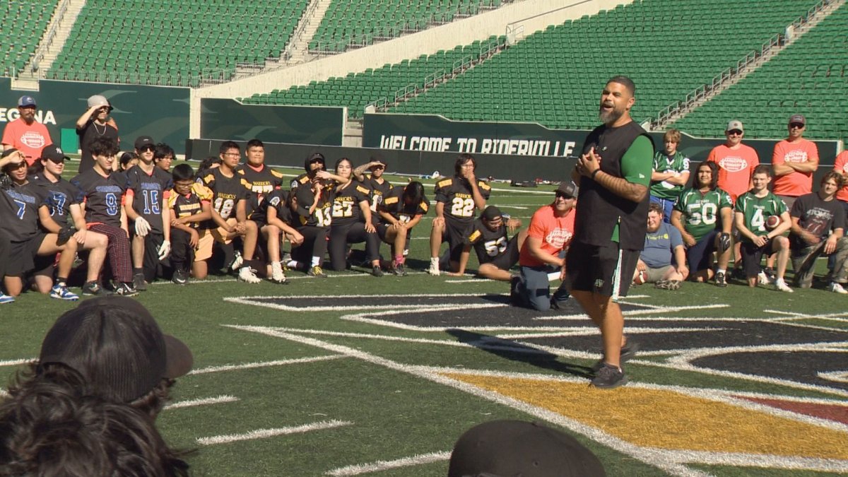 Saskatchewan Roughriders head coach Corey Mace talks to the students ahead of the camp.