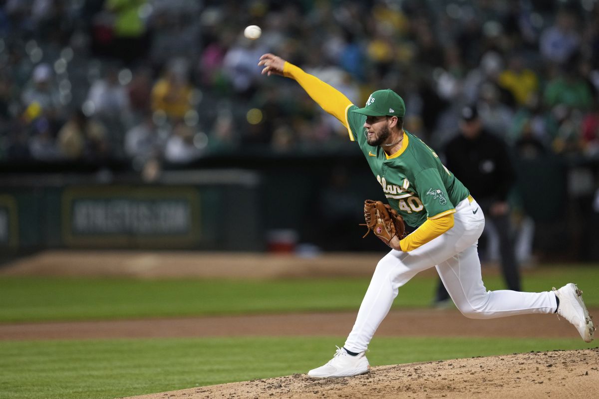 Oakland Athletics' Mitch Spence pitches to a Texas Rangers batter during the third inning of a baseball game Tuesday, Sept. 24, 2024, in Oakland, Calif.