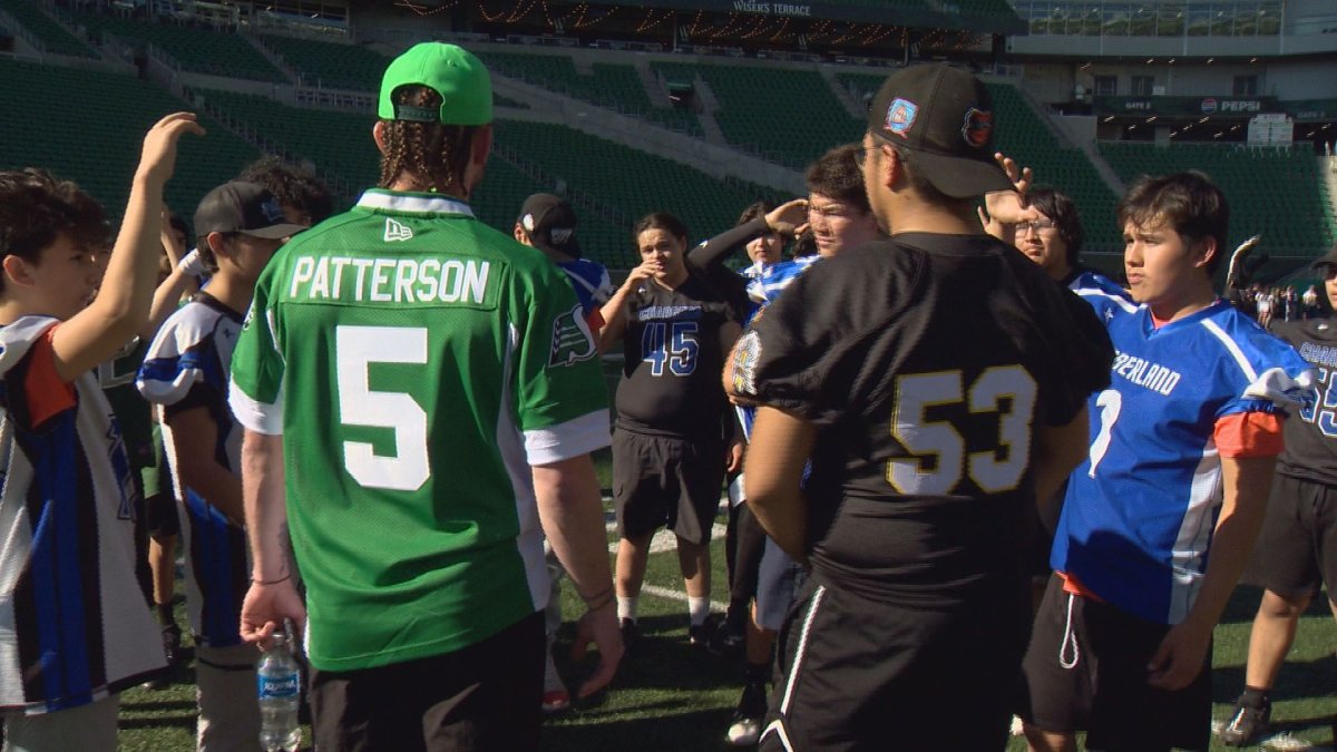 Saskatchewan Roughriders quarterback Shae Patterson walks through a drill with players.