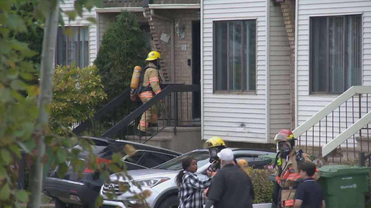 Montreal’s fire department goes door to door after a fire involving lithium batteries at the Port of Montreal on Sept. 23, 2024.