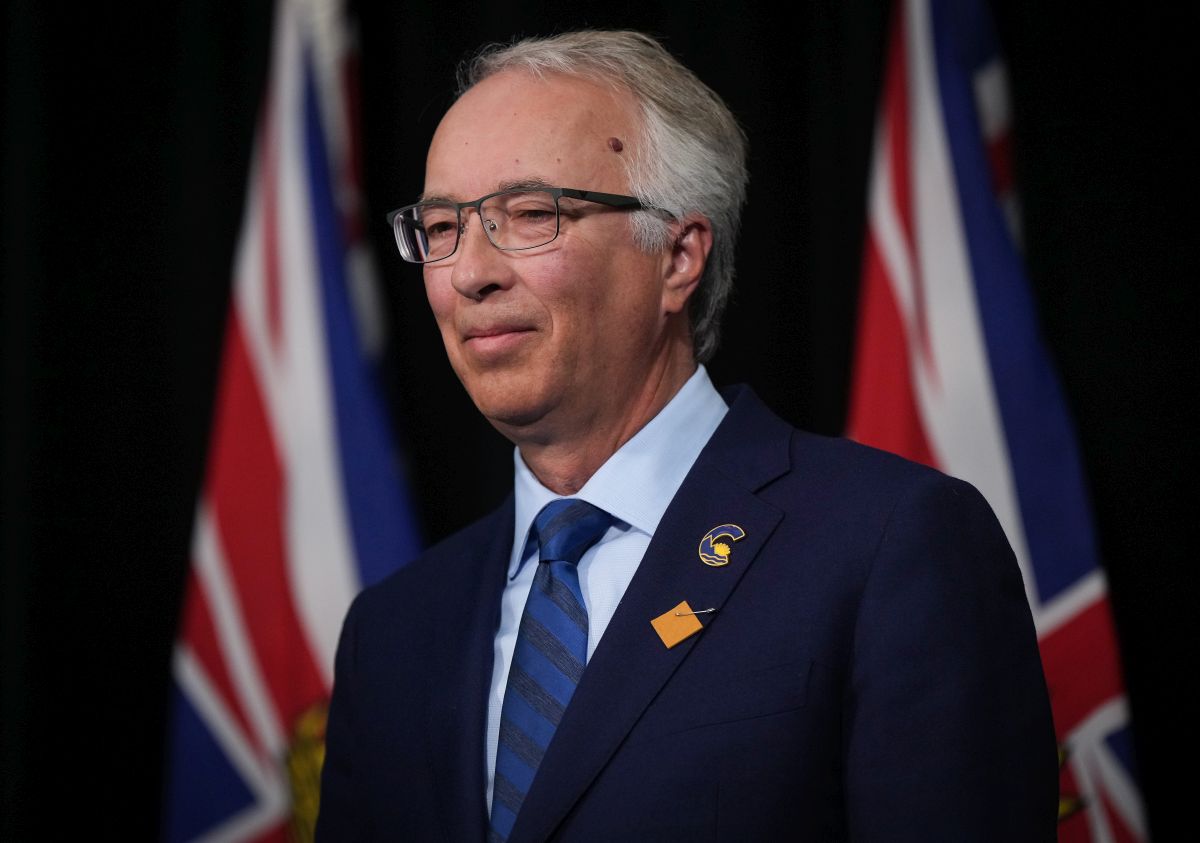 BC Conservative Leader John Rustad listens during a news conference with BC United Leader Kevin Falcon in Vancouver, on Wednesday, August 28, 2024.
