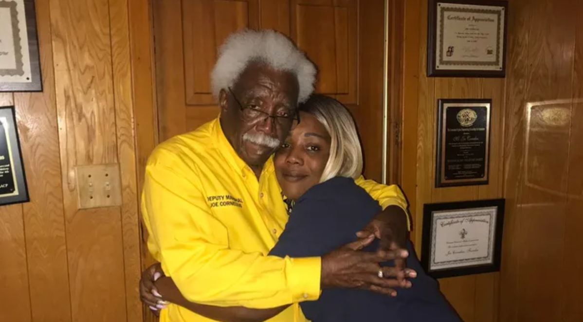 Photo of Joe Cornelius Sr. and his daughter Keisha Miles embracing.