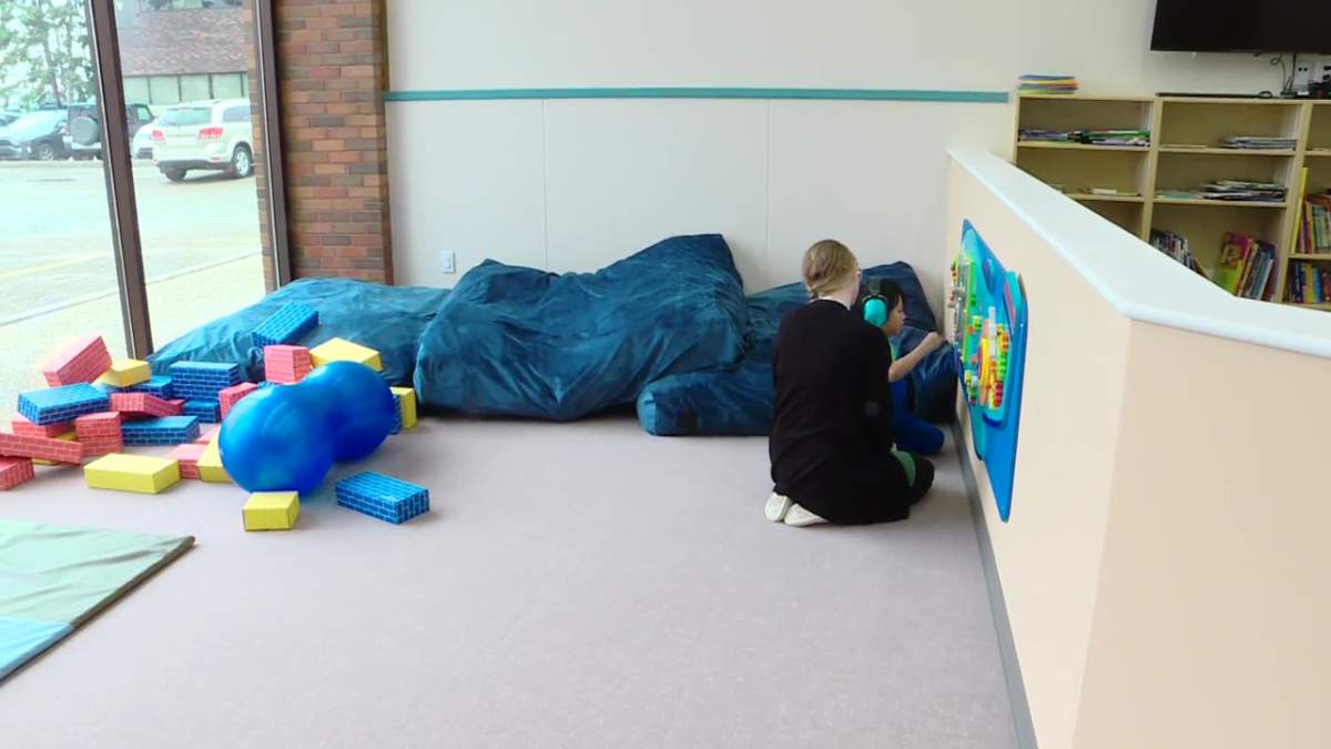 A student and instructor at the Jim Jiwani Autism Academy in Edmonton on Thursday, September 12, 2024.