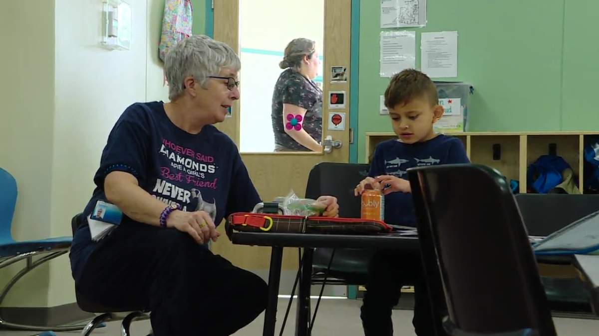 A student and instructor at the Jim Jiwani Autism Academy in Edmonton on Thursday, September 12, 2024.