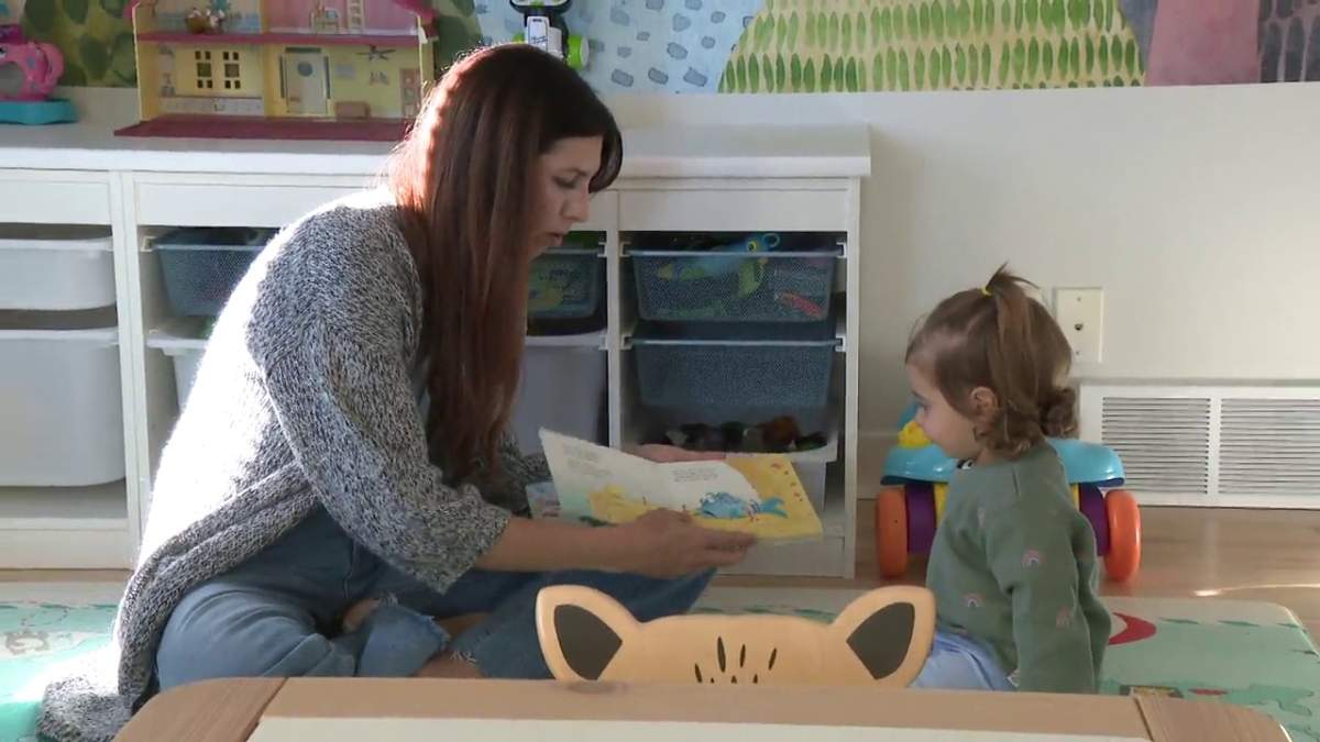 Katrina Bellavance sits with her 20-month-old daughter.
