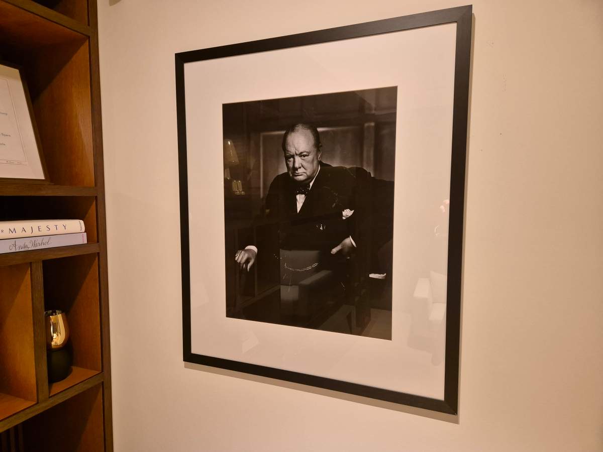 A replica of the Roaring Lion portrait is seen in the home of Nicola Cassinelli, who bought the original portrait from a London auction house in 2022 without realizing it had actually been stolen. Cassinelli returned the original portrait to Canadian officials and bought a poster of the photo, which now hangs where the original portrait hung in his home.