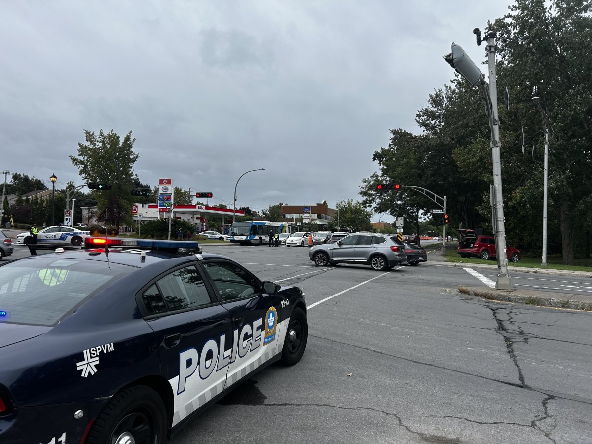 Montreal police direct traffic in the West Island as the Presidents Cup gets underway on Sept. 25, 2024.