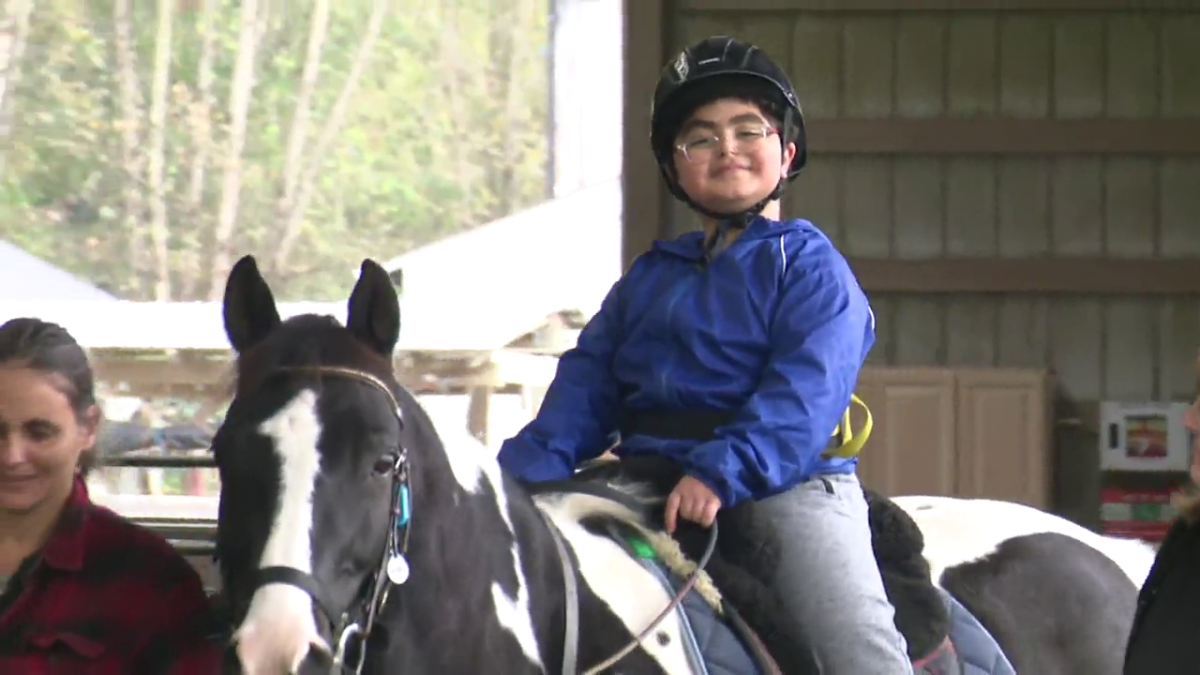 Ten-year-old Mustafa rides a horse at the North Fraser Therapeutic Riding Association in Maple Ridge. 