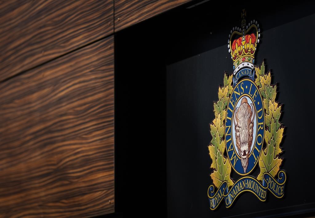 The RCMP logo is seen outside the force's 'E' division headquarters in Surrey, B.C., on Thursday, March 16, 2023. An Alberta man is dead after his kayak capsized on the Athabasca River. THE CANADIAN PRESS/Darryl Dyck.