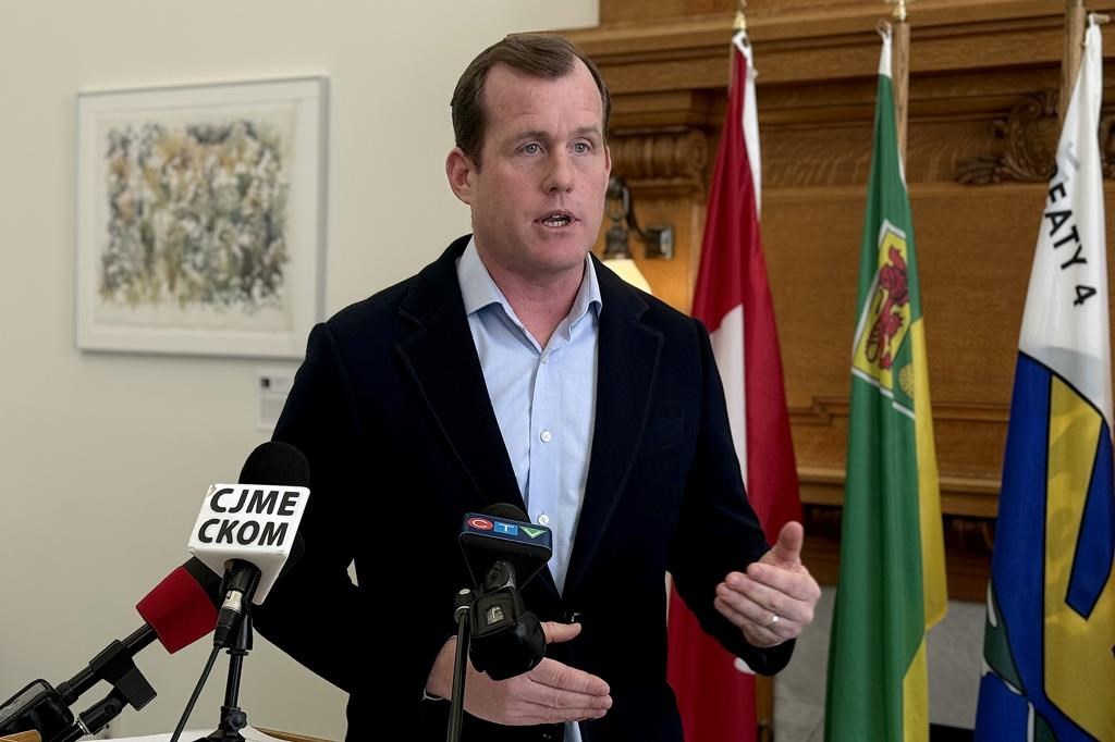 Saskatchewan NDP's Trent Wotherspoon speaks to reporters at the Saskatchewan Legislature Building in Regina, Thursday, Feb. 22, 2024. Wotherspoon says Moe hiked 31 taxes and fees in a single year while premier, making life more unaffordable for Saskatchewan residents. THE CANADIAN PRESS/Jeremy Simes.