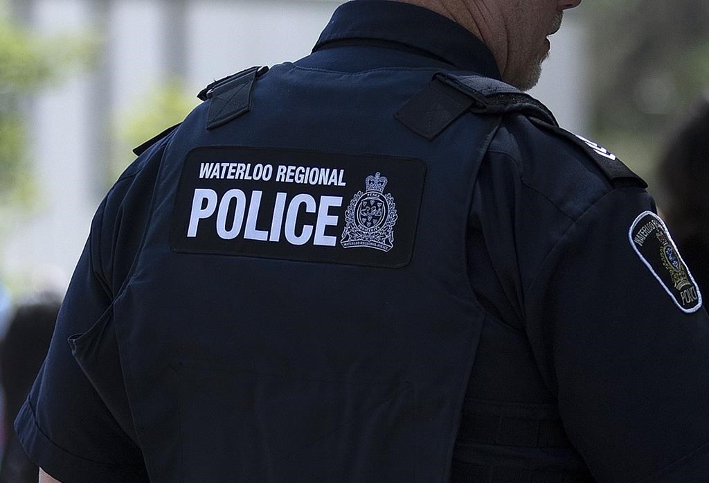 A Waterloo Regional Police officer looks on during an event in Waterloo, Ont., Thursday, June 29, 2023. THE CANADIAN PRESS/Nicole Osborne.