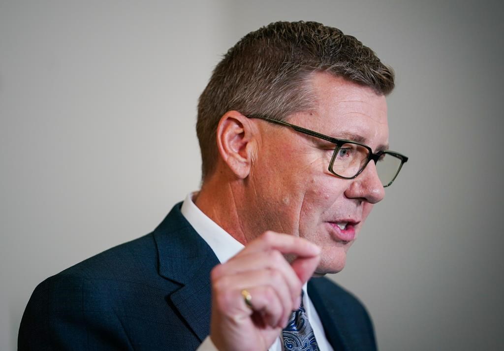 Saskatchewan Party Leader Scott Moe says his party would bar “biological boys" from using school changing rooms with "biological girls" if re-elected on Oct. 28. Moe gestures while speaking to the media after a televised leaders' debate in Regina, on Wednesday, Oct. 16, 2024.