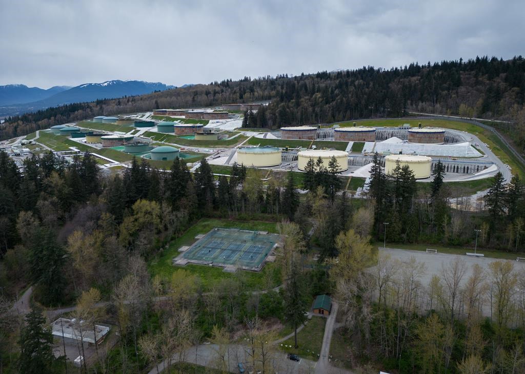 Nearly six months after its opening, the Trans Mountain pipeline expansion is boosting Canada's energy sector as promised — but questions still linger about who will pay for the project's massive cost overruns. In this photograph taken with a drone, the Trans Mountain Burnaby Terminal tank farm is seen in Burnaby, B.C., on Thursday, April 4, 2024. THE CANADIAN PRESS/Darryl Dyck