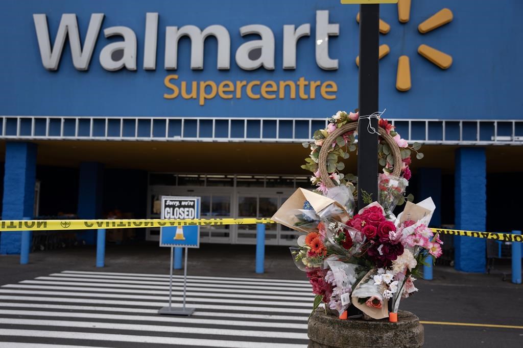 A Walmart remains closed as a vigil grows outside the taped-off area in Halifax on Wednesday, October 23, 2024 following the death of a 19-year-old employee last weekend.  THE CANADIAN PRESS/Darren Calabrese