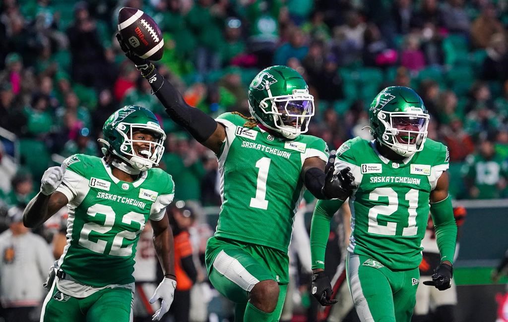 Saskatchewan Roughriders defensive back C.J. Reavis (1) celebrates with defensive back DaMarcus Fields (22) and defensive back Nelson Lokombo (21) after recovering a fumble against the B.C. Lions during the first half of CFL football action in Regina, Saturday, Oct. 12, 2024. THE CANADIAN PRESS/Heywood Yu.