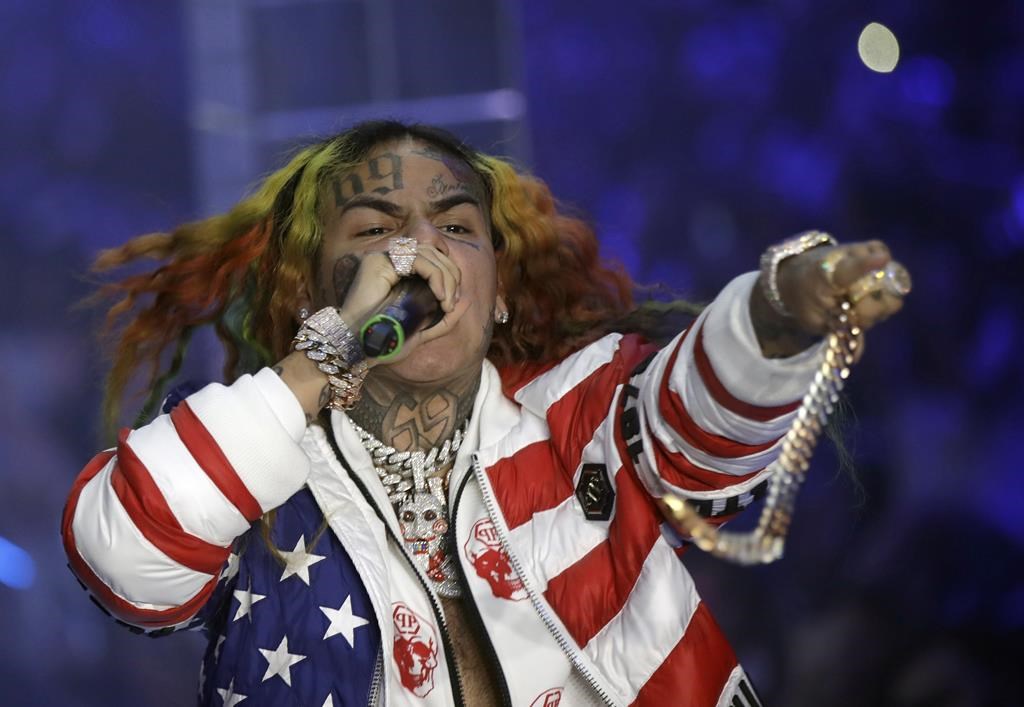 Rapper Daniel Hernandez, known as Tekashi 6ix9ine, performs during the Philipp Plein Women's 2019 Spring-Summer Collection at Fashion Week in Milan, Italy, Sept. 21, 2018.