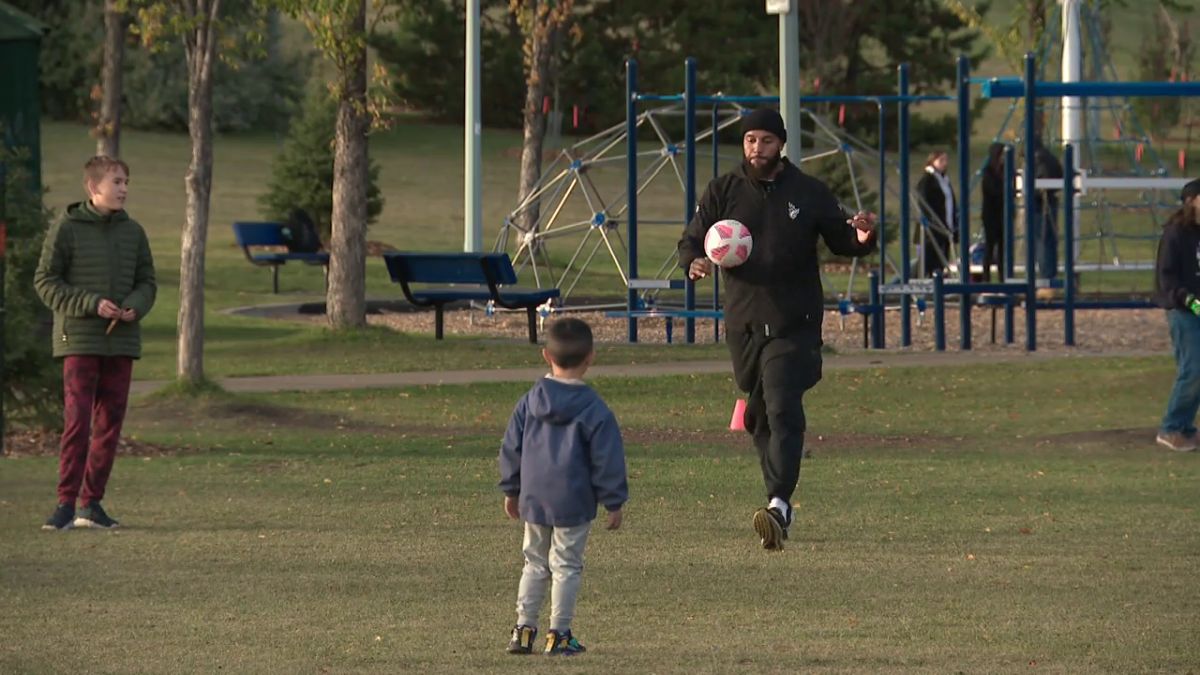 Boris Bede plays soccer with a group of kids in northeast Edmonton in 2024.