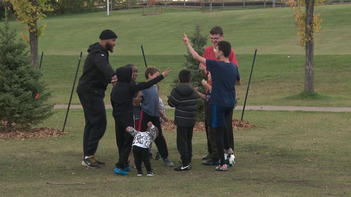 Boris Bede plays soccer with a group of kids in northeast Edmonton in 2024.