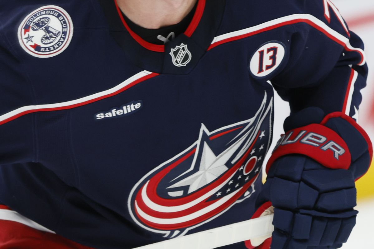 Columbus Blue Jackets players wear helmet stickers and patches honouring Johnny Gaudreau and his brother Matthew during the first period of an NHL hockey game against the Florida Panthers Tuesday, Oct. 15, 2024, in Columbus, Ohio. All teams in the NHL will wear helmet stickers honouring the Gaudreau brothers.