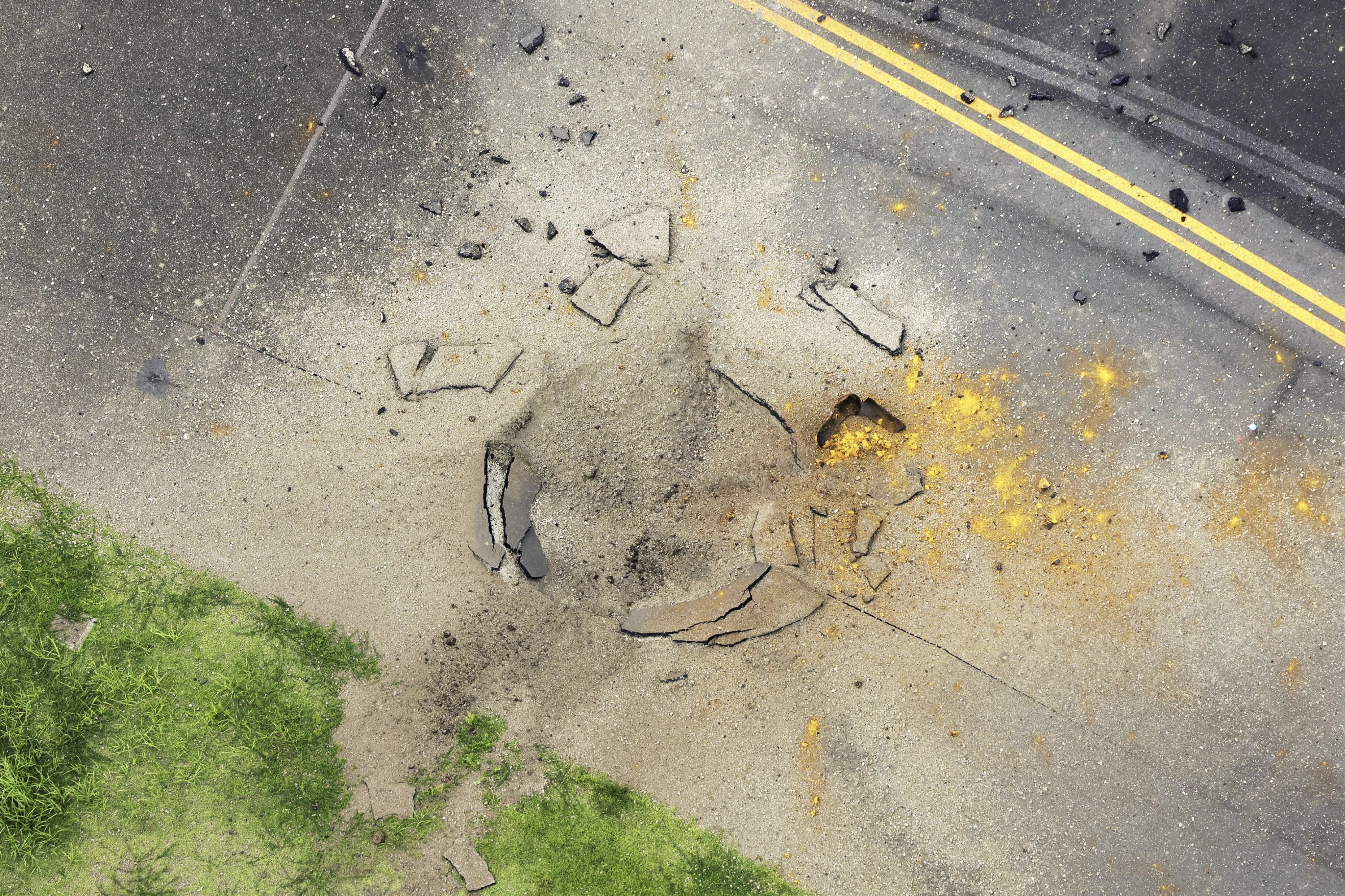 WWII-era U.S. bomb explodes at Japanese airport, leaving crater in runway