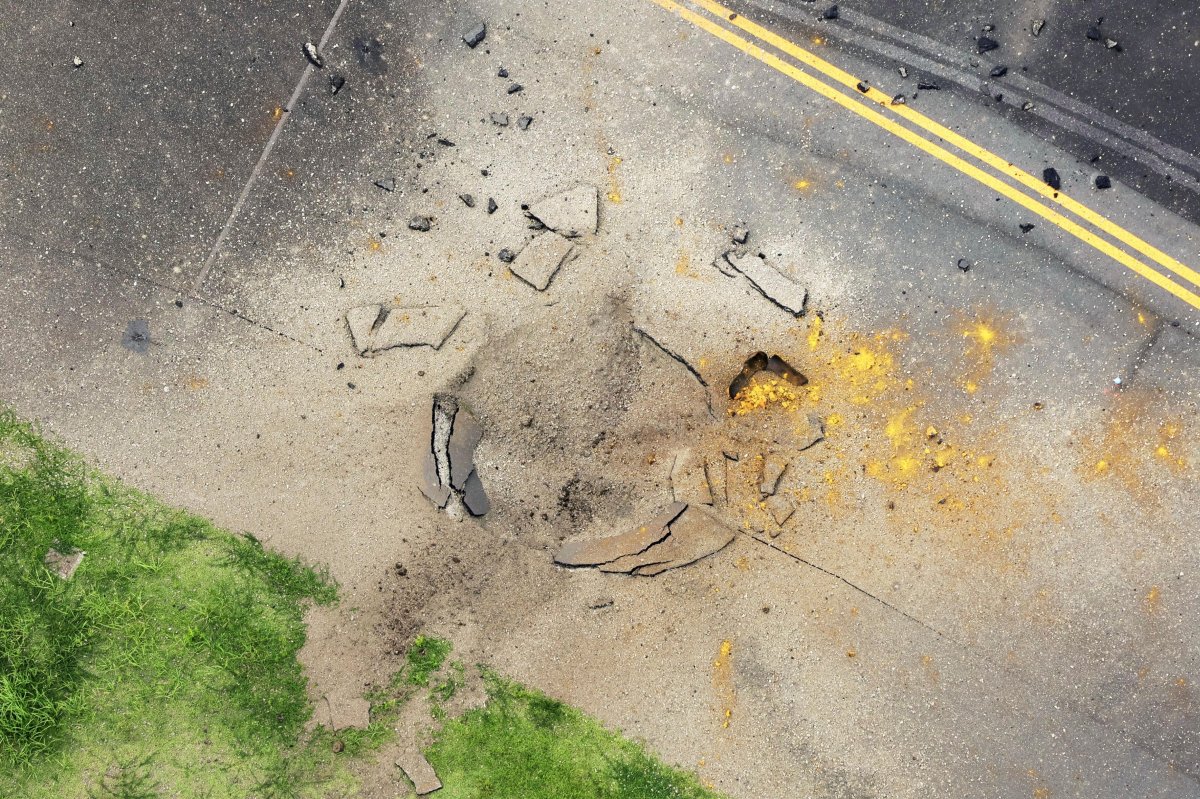 A crater in the pavement.