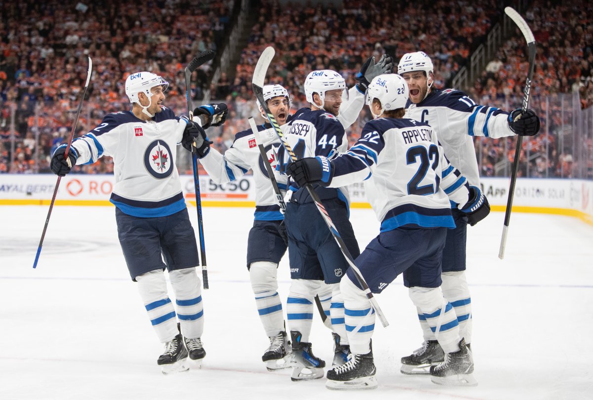 Winnipeg Jets players celebrate a goal against the Edmonton Oilers during first period NHL action in Edmonton on Wednesday October 9, 2024. THE CANADIAN PRESS/Amber Bracken.