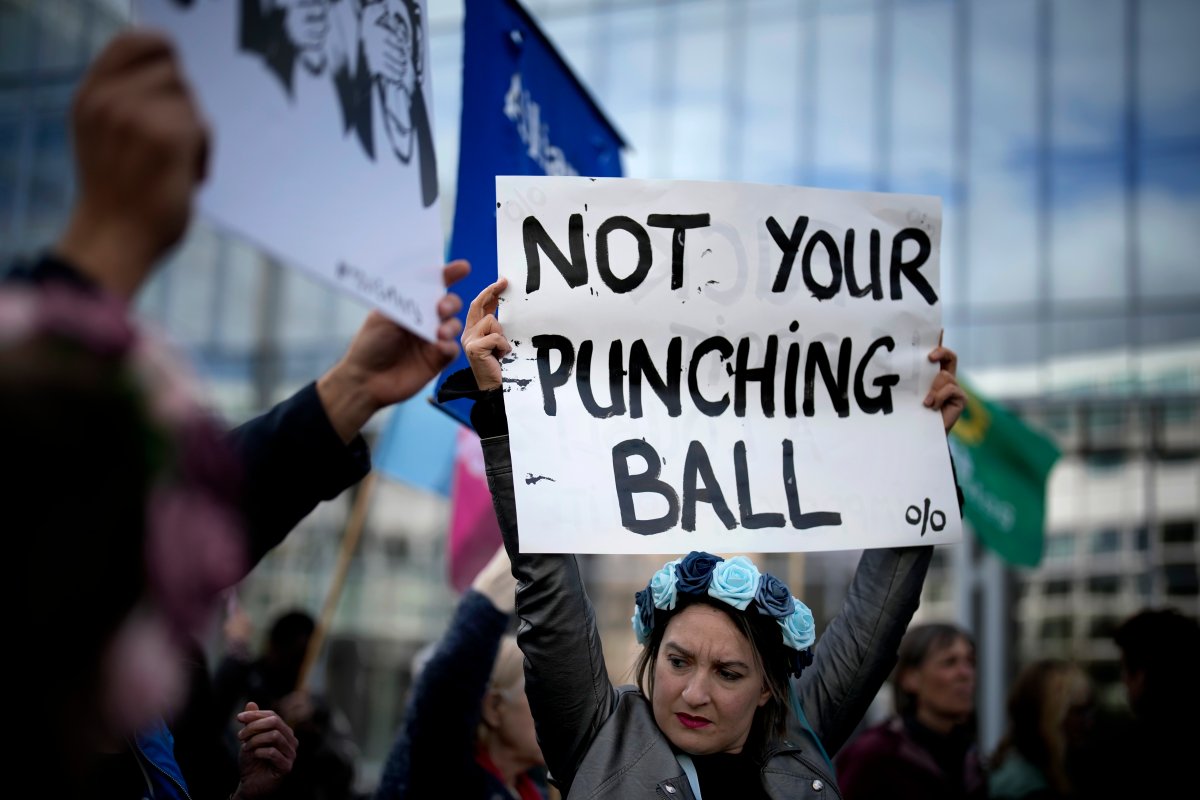 People gather to take part in a protest against sexual violence, in Paris, France, Saturday, Oct. 19, 2024.