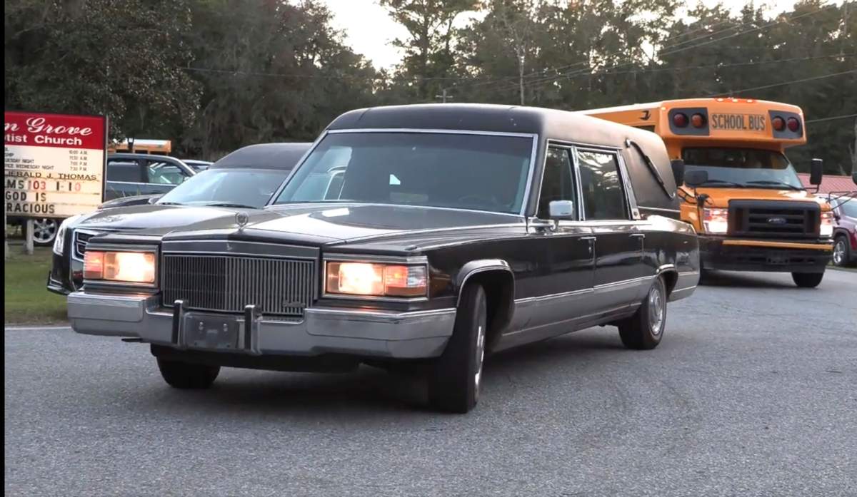 A hearse heads to Meridian Dock in McIntosh county where several people after a gangway collapsed plunging them into the water, on Sapelo Island, Ga., in McIntosh county, Sunday, Oct. 20, 2024.