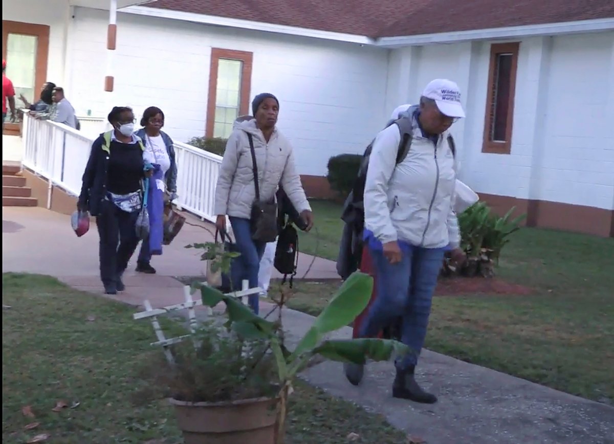 Festival goers who attended a Gullah Geechee festival on Sapelo Island leave the Elm Grove Church where they were taken to reunite with loved ones on Sapelo Island, Ga., in McIntosh county, Sunday, Oct. 20, 2024.