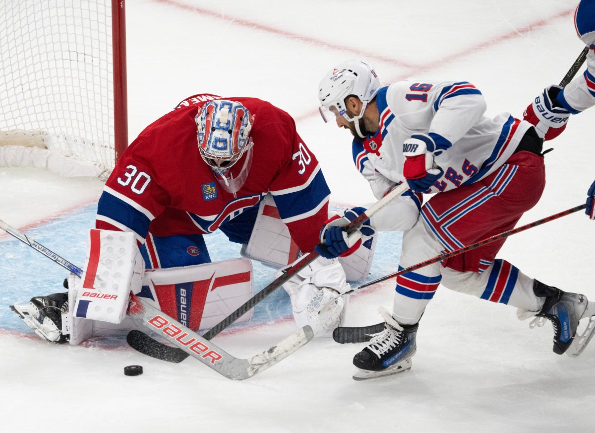 Montreal Canadiens goaltender Cayden Primeau (30) stops New York Rangers' Vincent Trocheck (16) during second period NHL hockey action Tuesday, October 22, 2024 in Montreal. 