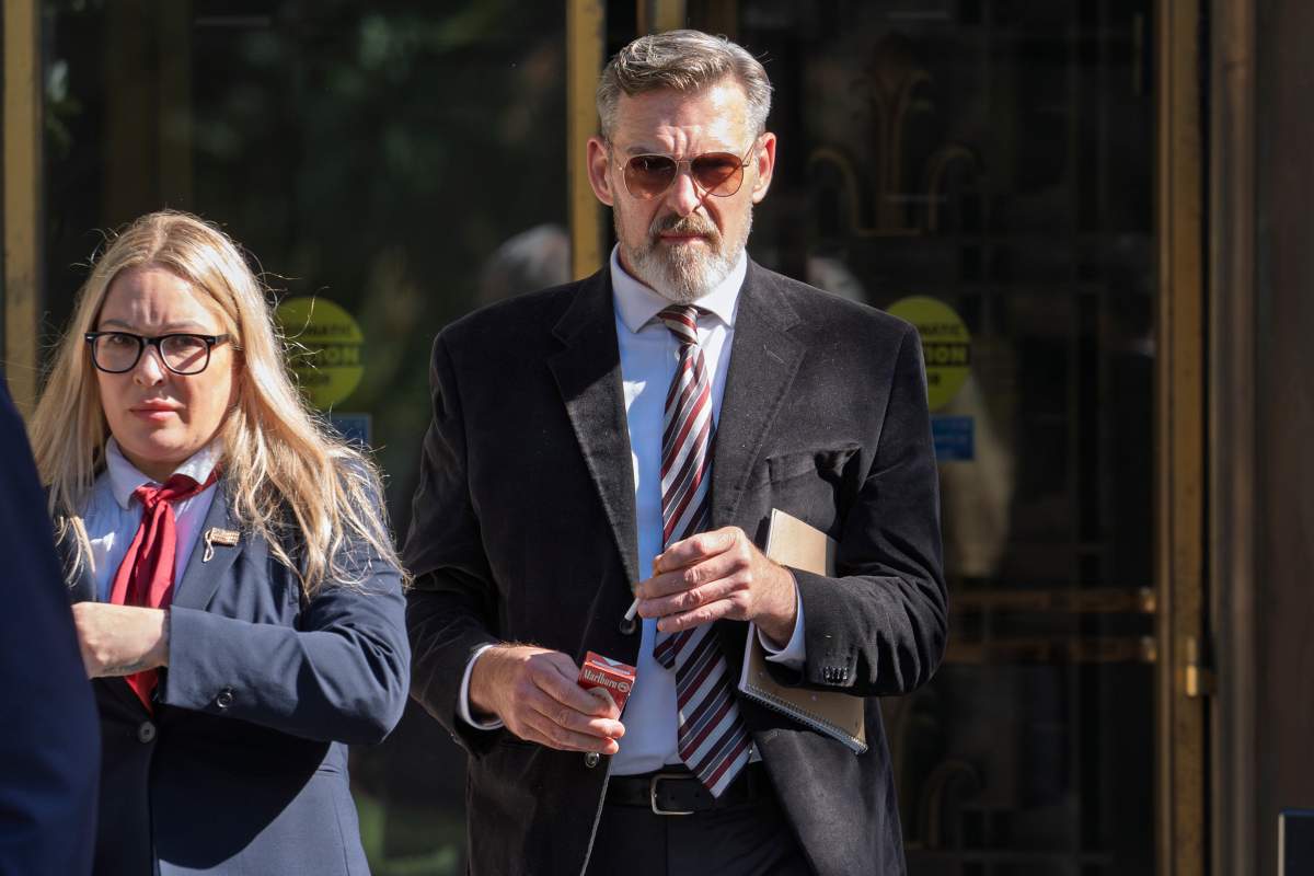 Actor Jay Johnston emerges from the U.S. District Courthouse in Washington, Monday, Oct. 28, 2024, after been sentenced to one year in prison for his part in a mob’s attack on the U.S. Capitol nearly four years ago. Johnston joined other rioters in a 'heave ho' push against police officers guarding a tunnel entrance to the Capitol during the Jan. 6, 2021, riot.