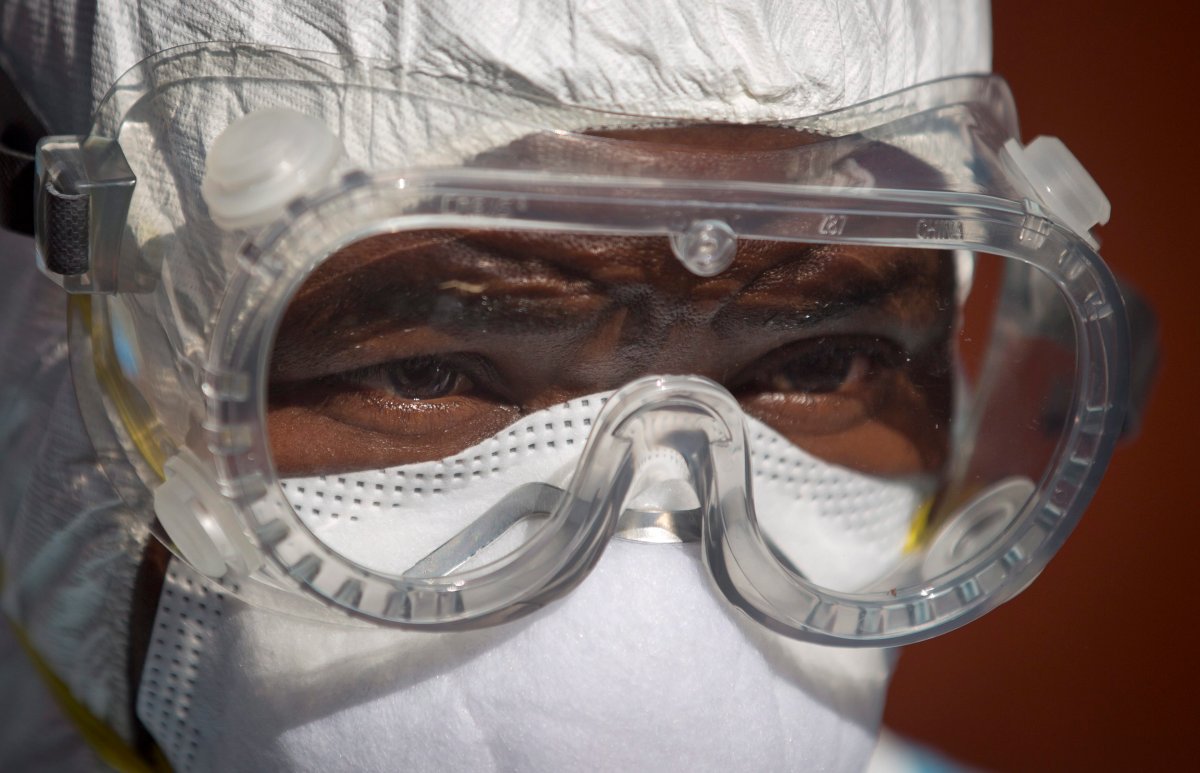 In this Oct. 8, 2014 photo, a medical worker from the Infection Prevention and Control unit wearing full protective equipment prepares to enter an isolation tent housing a man being quarantined after coming into contact in Uganda with a carrier of the Marburg Virus, a hemorrhagic fever from the same family as Ebola, at the Kenyatta National Hospital in Nairobi, Kenya. Health officials battling the Ebola outbreak that has killed more than 4,500 people in West Africa have managed to limit its spread on the continent to five countries, with Kenya so far escaping the virus.