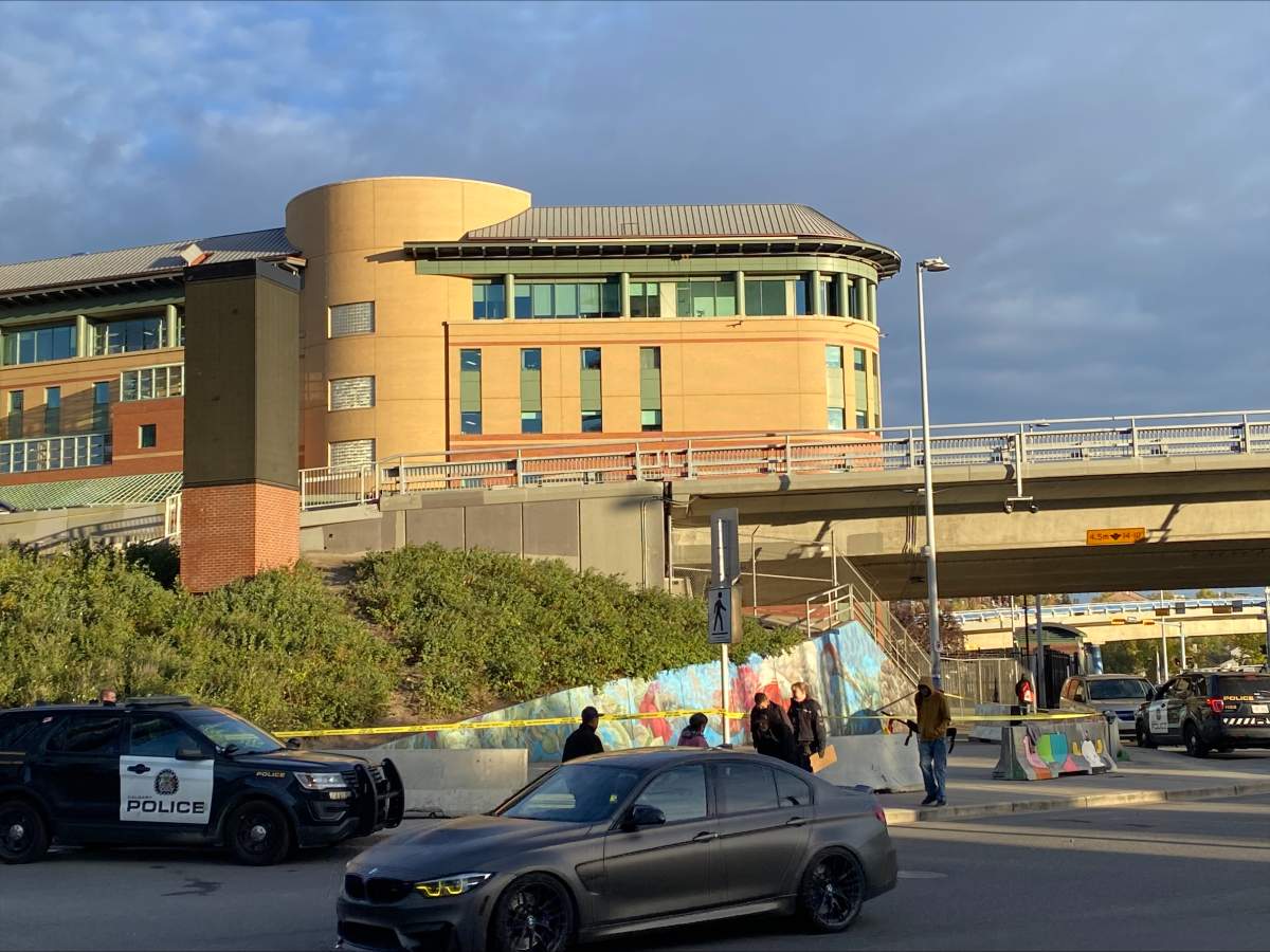 Police remained at the scene of a shooting outside the Calgary Drop-In Centre on Oct. 3, 2024. Police were called to the shooting a day earlier.