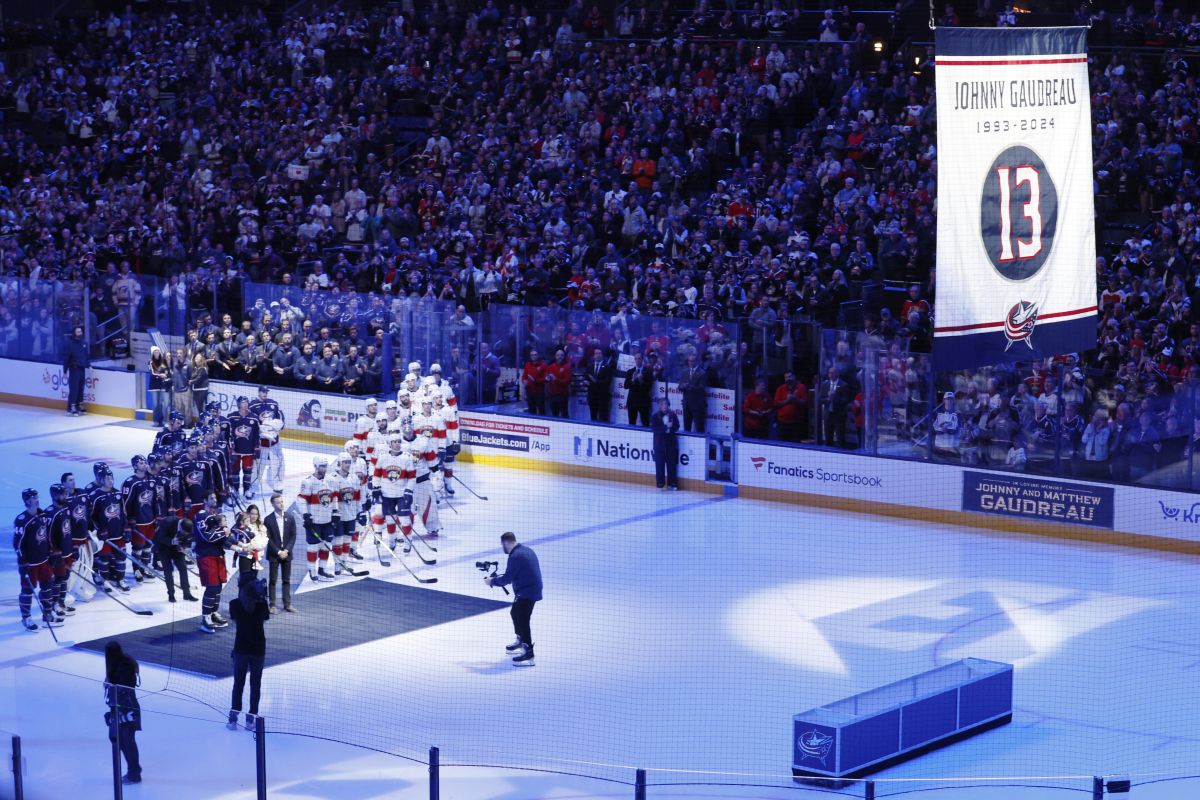 Blue Jackets' Johnny Gaudreau's family watches a #13 banner being raised during a ceremony before the start of an NHL hockey game between the Columbus Blue Jackets and the Florida Panthers. Tuesday, Oct. 15, 2024, in Columbus, Ohio.