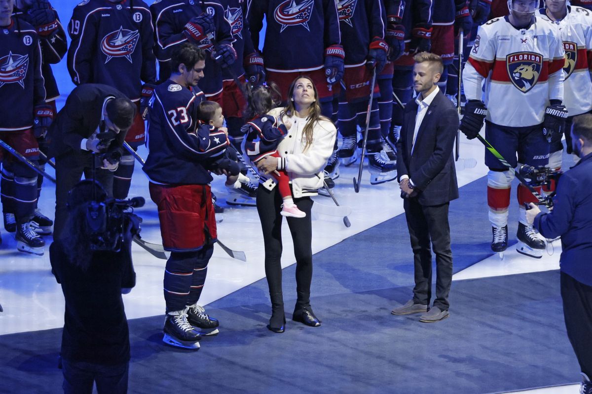 Blue Jackets' Johnny Gaudreau's family watches a #13 banner being raised during a ceremony before the start of an NHL hockey game between the Columbus Blue Jackets and the Florida Panthers. Tuesday, Oct. 15, 2024, in Columbus, Ohio.