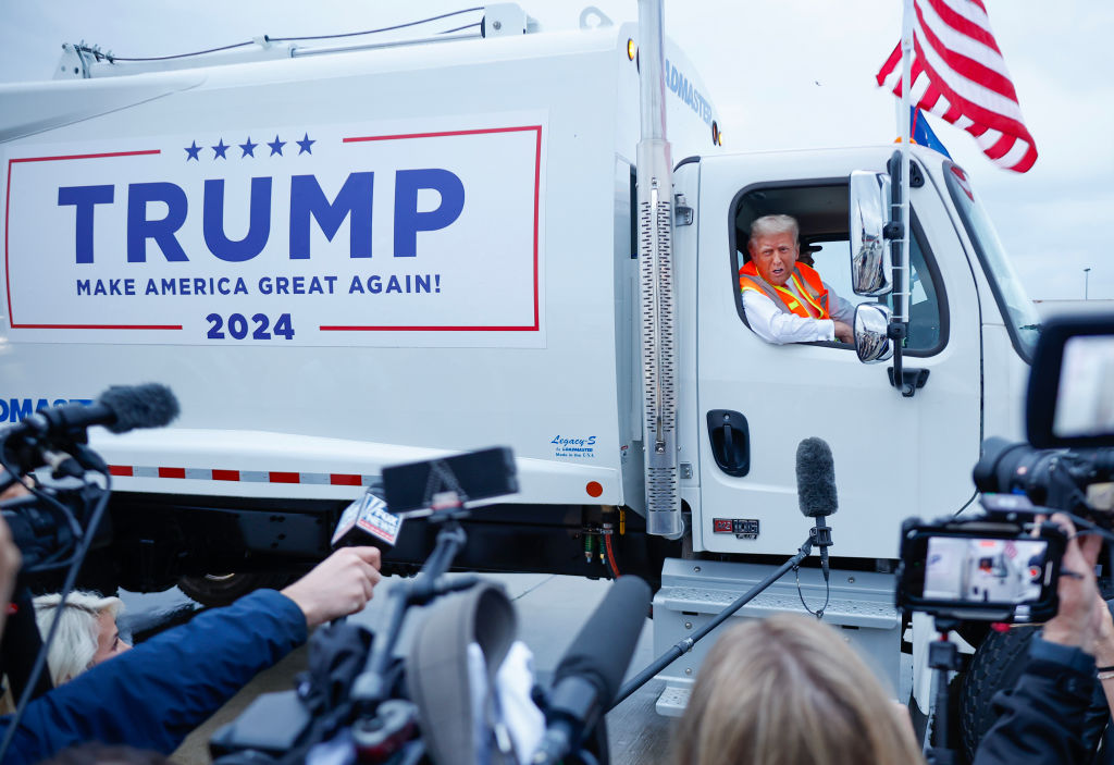 Republican presidential nominee, former President Donald Trump holds a press conference from inside a garbage truck at Green Bay Austin Straubel International Airport on October 30, 2024 in Green Bay, Wisconsin.