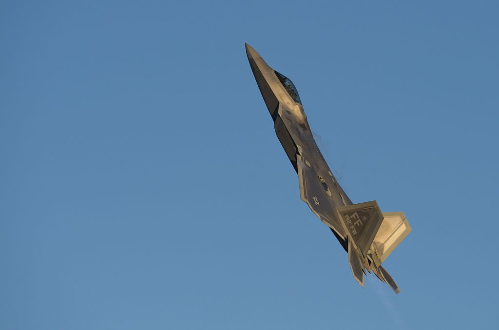 A US Air Force Lockheed Martin F-22 Raptor stealth fighter aircraft performs a demonstration flight during the inaugural Trilateral Exercise between the US Air Force, United Kingdom's Royal Air Force and the French Air Force at Joint Base Langley-Eustis in Hampton, Virginia, December 15, 2015.