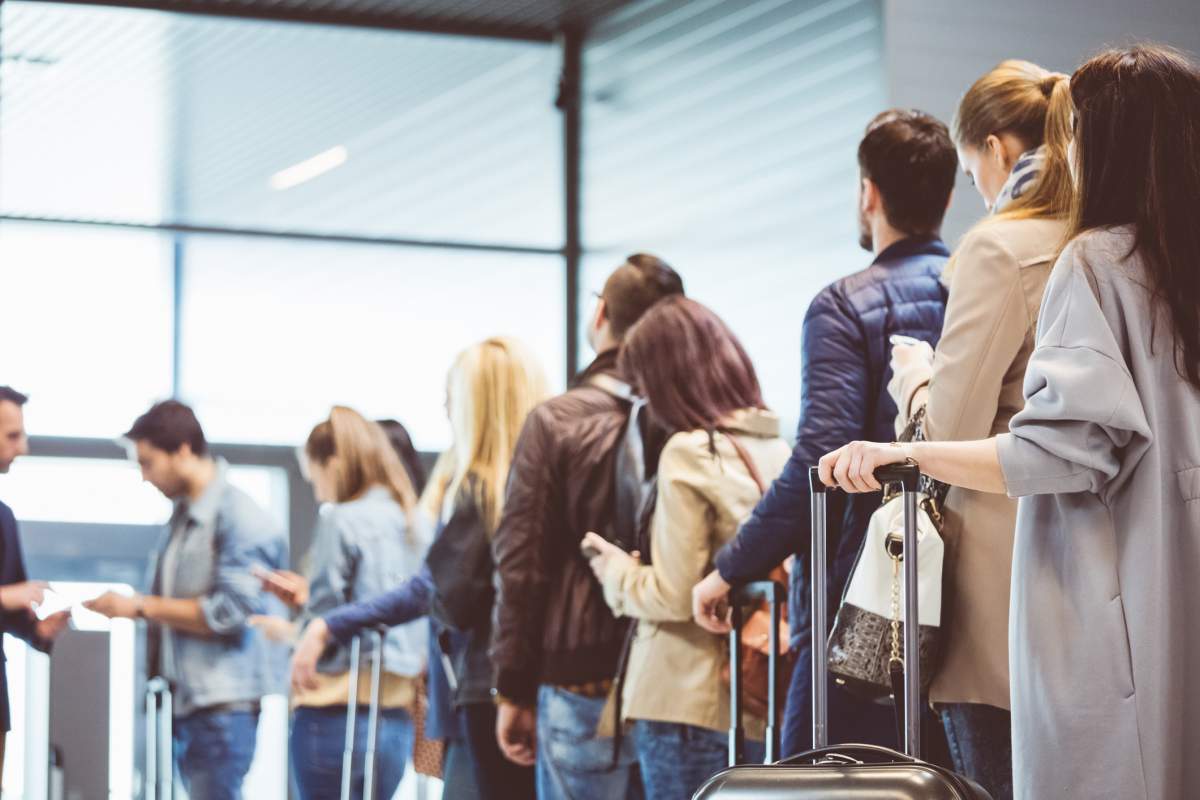 A lineup of people boarding a plane.