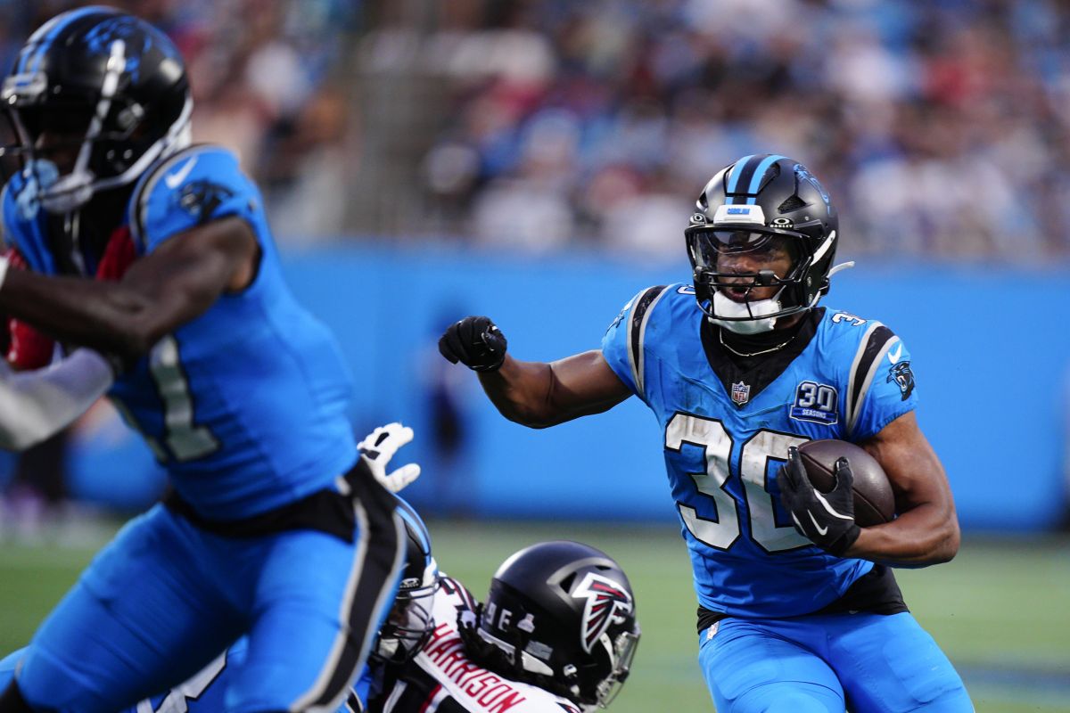 Carolina Panthers running back Chuba Hubbard (30) runs the ball in the second half of an NFL football game against the Atlanta Falcons in Charlotte, N.C., Sunday, Oct. 13, 2024.